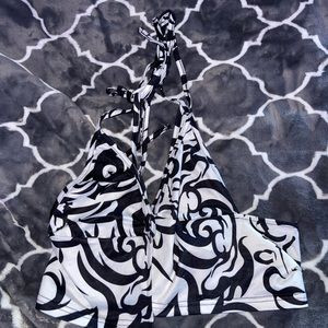 white and black swirled design crop top.